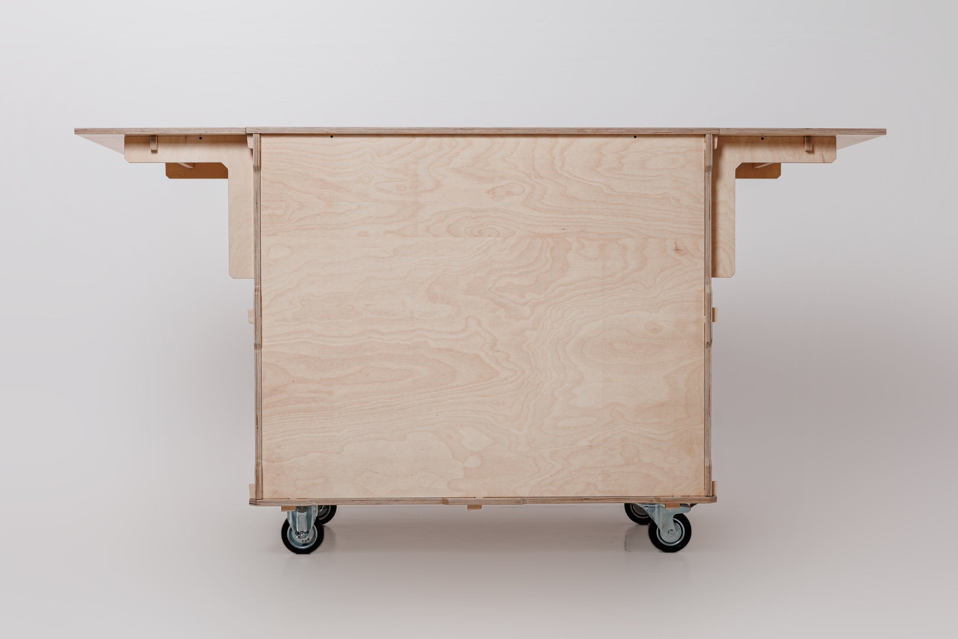 Front view of a mobile coffee cart showcasing a foldable worktop, large storage space, and sturdy design for versatile coffee service