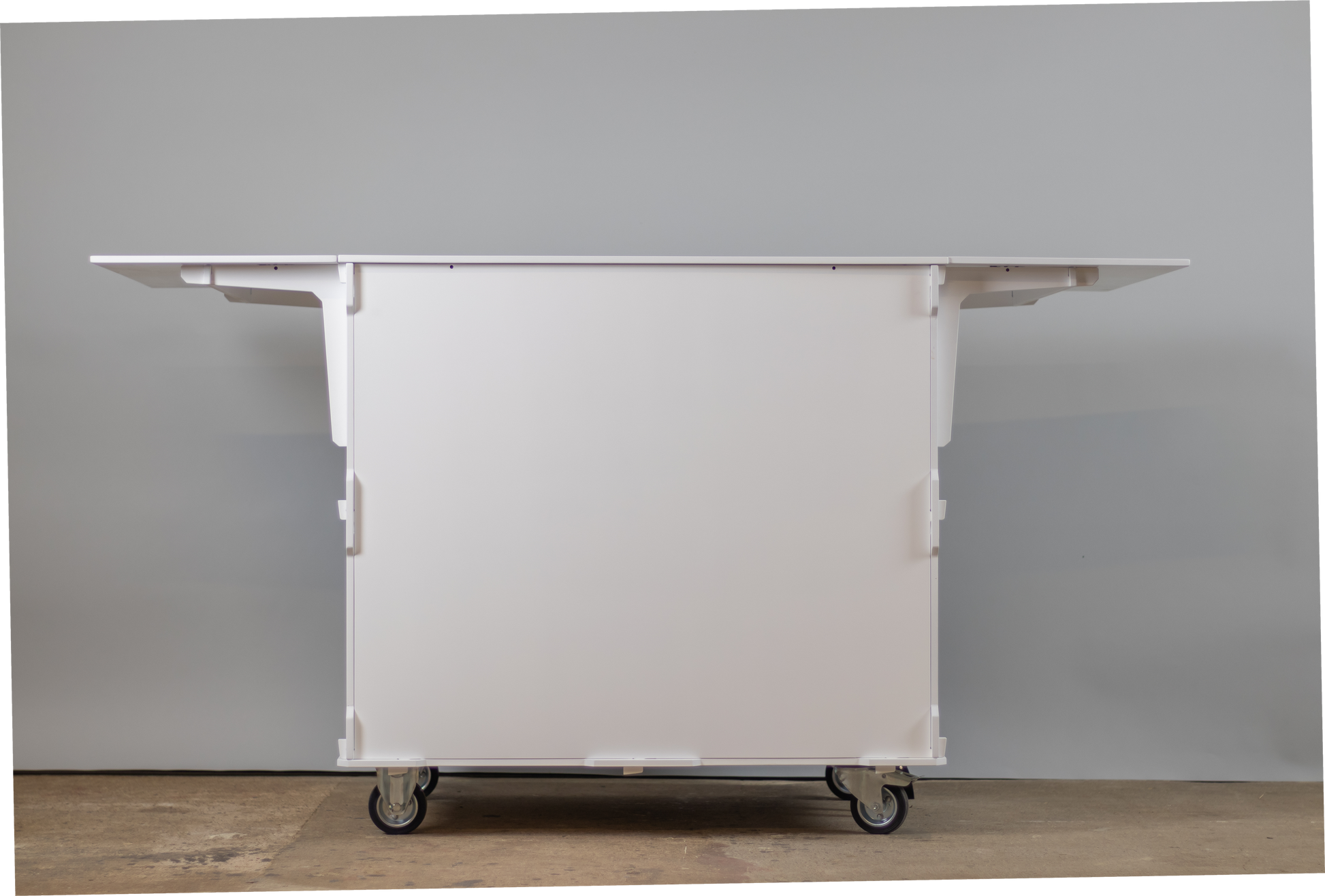 Front view of a mobile coffee cart showcasing a foldable worktop, large storage space, and sturdy design for versatile coffee service